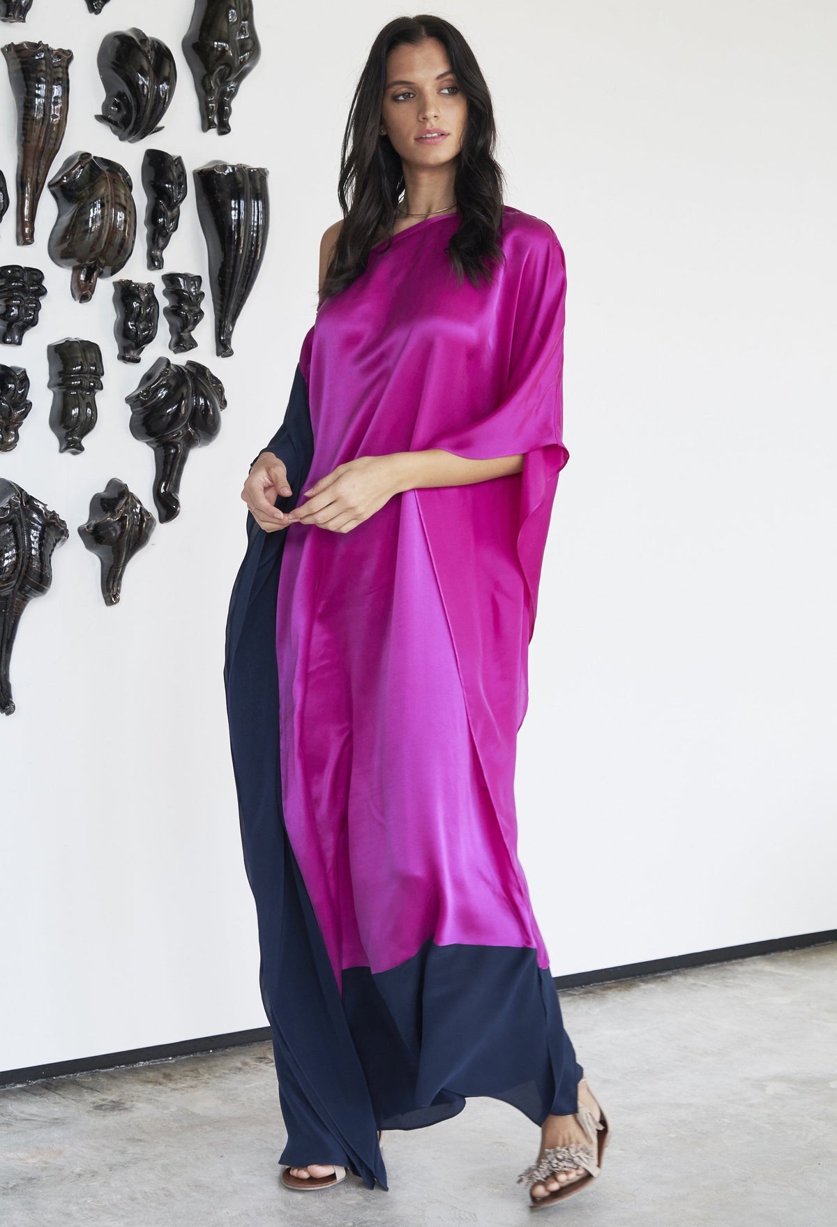 Woman standing sideways wearing ocean+main Fuchsia And Navy Contrast Boatneck Silk Caftan